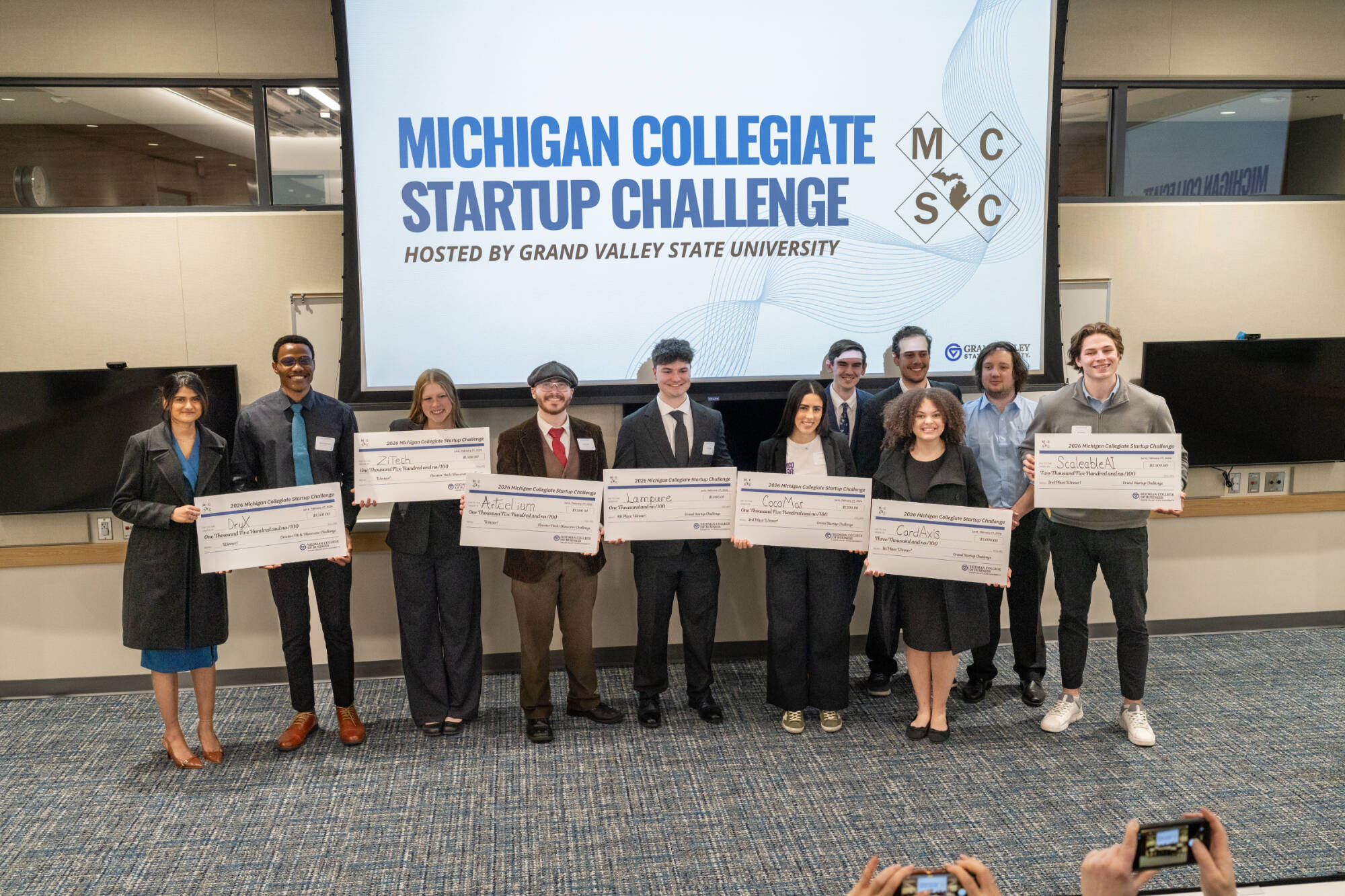 2026 MCSC winners holding their checks